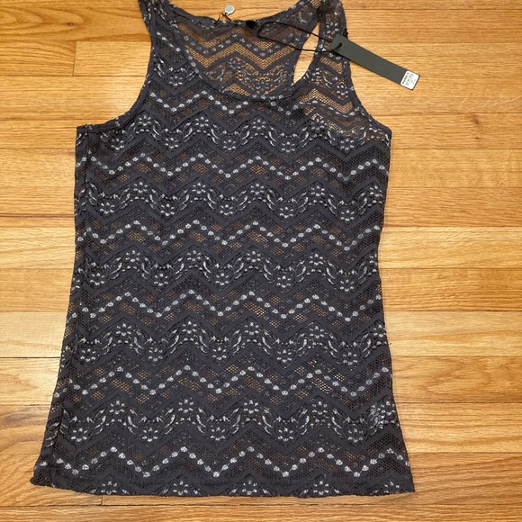 Buckle Tops - Sleeveless top with silver detail, sheer. Size large NWT
